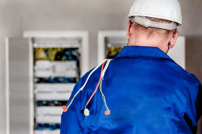 Electrician working on a consumer unit